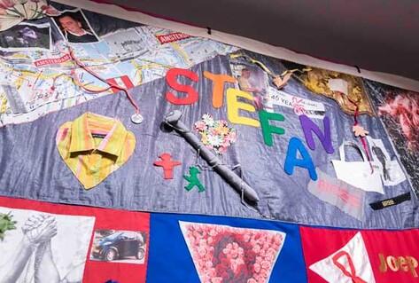 Colourful collage quilt commemorating AIDS victims