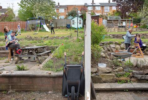 Children having having haircuts in back gardens