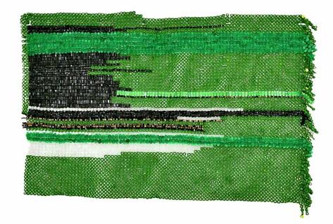 Green and black mosaic flag made from computer parts