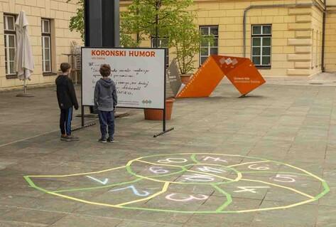 Children reading sign with joke on