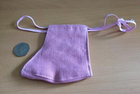 Purple face mask for child on table