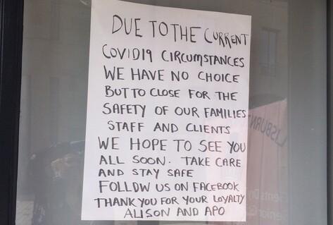 Closed sign on door of Turkish barbers
