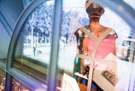 Girl looking at museum content