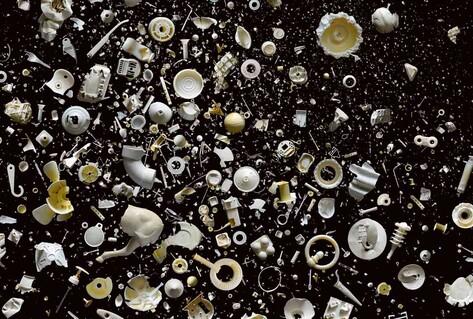 White rubbish objects on black background