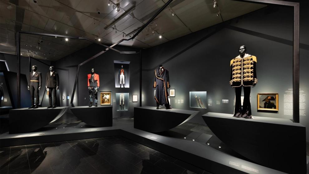 Mannequins and paintings in museum