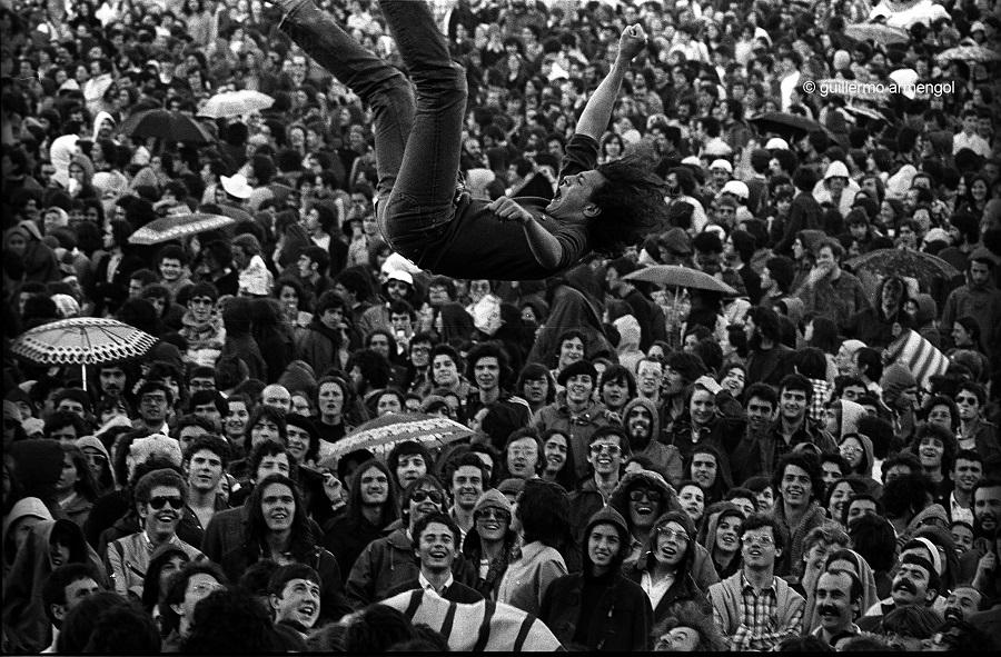 Person jumping in protest crowd