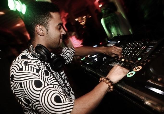 DJ mixing on decks in club