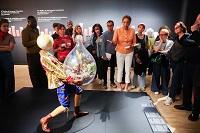 Woman giving tour in museum