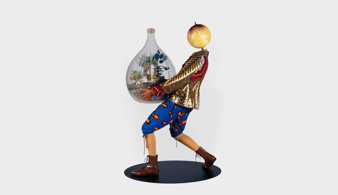 Wooden puppet figure carrying glass jar